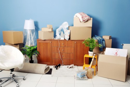 Professional movers handling boxes during a Belmont small removal