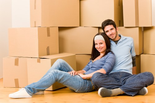 Professional movers packing household items for Belmont removals