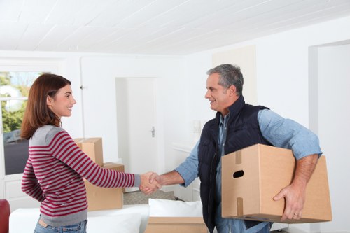 Professional movers handling furniture during house removals in Belmont